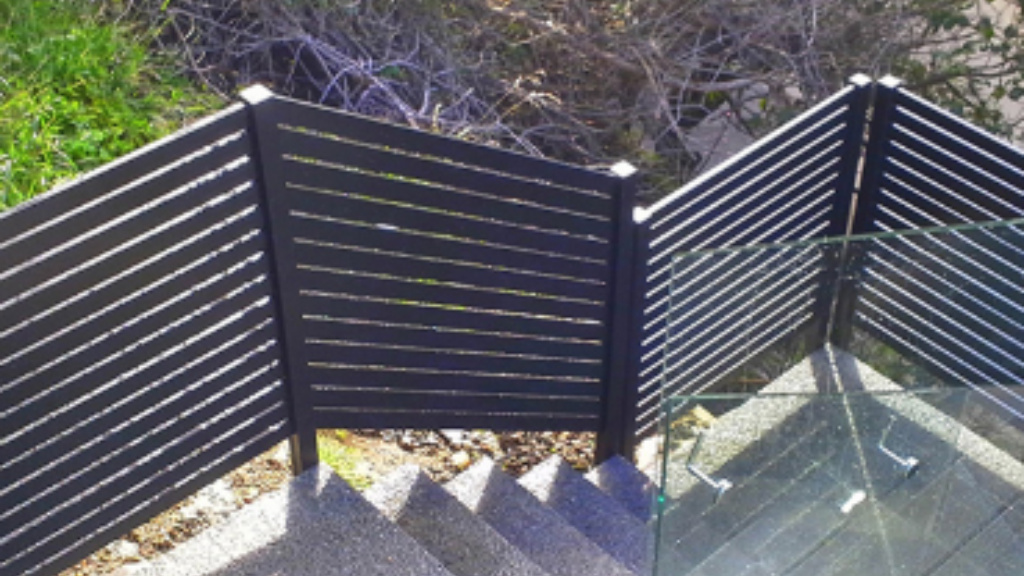 Privacy fences installed around stairs by Provista Balustrade Systems for safety and seclusion