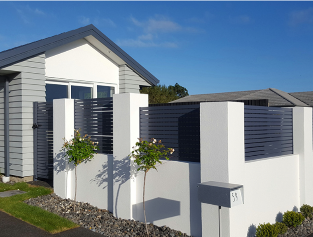Clean lines of Aluminium Privacy Screens NZ against sky and greenery